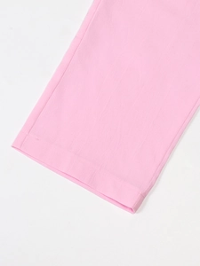 Detail of pink cotton linen pants showing hem cuff and professional flat seam stitching