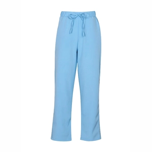 Close-up of light blue cotton linen pants featuring elastic drawstring waist and straight leg