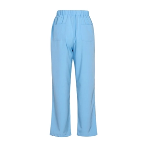 Detail view of light blue linen trousers with elastic waistband and rear patch pockets