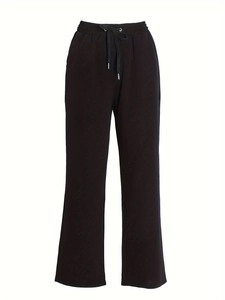 Detail of black drawstring waist on loose cotton linen casual straight leg pants