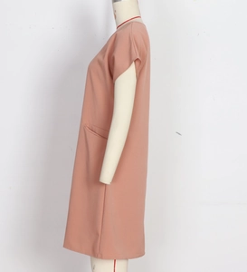 Detail view of the side pocket and soft fabric on a loose summer cotton-linen dress