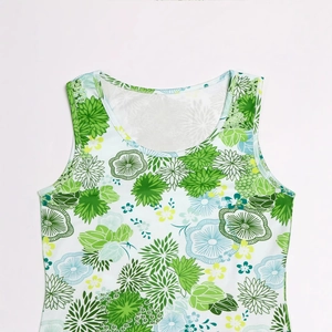 Close-up of fine stitching and vibrant floral print on white sleeveless beach dress