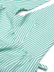 Detail of green white checkered seersucker fabric with fine pleated stitching and texture