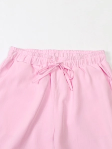 Women's pink linen blend suit set featuring elastic drawstring waist trousers in a casual fit