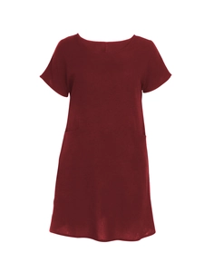 Detail of dark red linen blend dress showing natural fabric texture and functional pockets