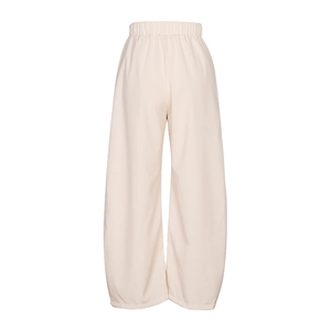 Detail view of the elastic waistband and high-quality beige linen fabric on casual trousers