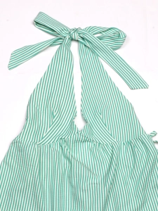 Close-up of green and white seersucker fabric with halter neck bow tie detail