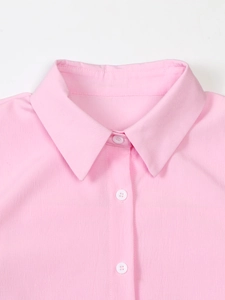 Women's light pink lapel blazer set with subtle textured fabric and button details