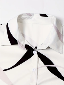 Close-up of a white long-sleeve printed shirt with classic lapel and button detail