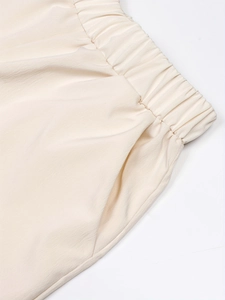 Creamy white cotton linen straight-leg trousers with elastic waist and side pockets