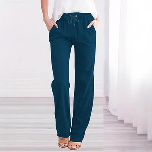 Detail of navy blue cotton linen pants featuring an elastic drawstring waist and side pockets