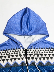 Detail of blue textured hoodie featuring geometric step patterns and black zip closure