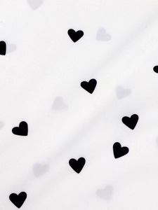 Women's casual white button shirt featuring a clean black heart print pattern