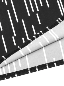 Close-up of high-quality double-needle stitching and black-white print on knit fabric