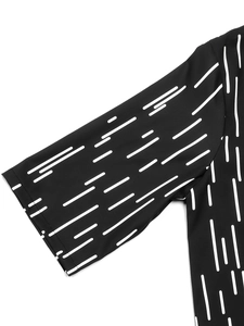 Detail of short sleeve with white abstract pattern and neat single-needle stitching