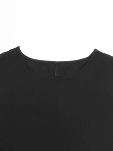 Detail view of the flat-stitched crew neckline on this pure black cotton blend summer dress