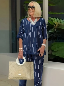 Navy blue two-piece cotton linen set with white vertical stripes and short sleeve top