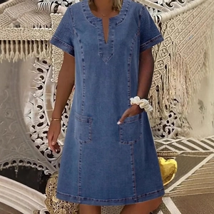 Short sleeve blue denim midi dress featuring a V-neckline and two front patch pockets
