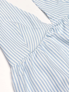 Detail shot of blue striped seersucker crop top with sexy V-neck and ruched texture