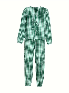 Détail d'un ensemble deux pièces vichy vert avec haut à nœuds et poignets élastiques