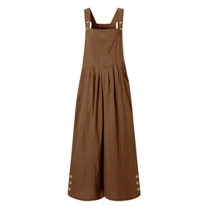 Detail of dark brown cotton-linen overalls with functional buttons and front pocket