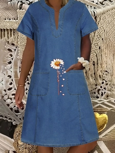 Women's blue denim-style summer dress with V-neck, daisy print, and convenient pockets