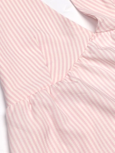 Detail of V-neckline with delicate gathers on pink and white striped cotton summer top