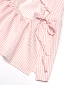 Detail of pink and white striped fabric with smocked waist and bow tie drawstring