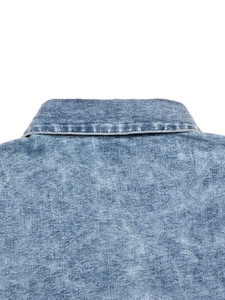 Detailed view of medium blue denim dress collar with double-needle stitching quality