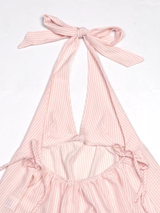 Detail of pink and white striped halter top featuring back lace-up ties and bow accent