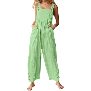 Detail of light green cotton linen overalls with wood buttons and wide leg fit