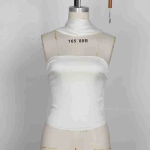 Detail of white satin tube top with matching neck scarf on a display mannequin