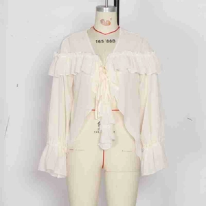 Detail of the multi-layered ruffles on cuffs and neckline of this cream chiffon blouse
