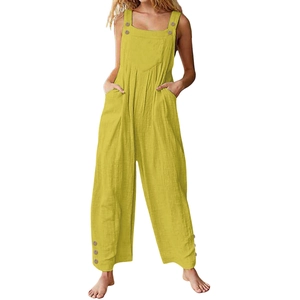 Detail view of ginger loose wide-leg overalls with adjustable button straps and front pocket