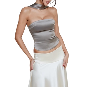 Detail of silver satin tube top with matching neck scarf showing glossy silk texture