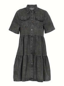 Detail of a dark denim short sleeve tiered dress with button-up front and classic collar