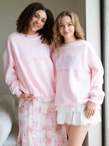 Light pink oversized sweatshirt with Oklahoma embroidery and dropped shoulders