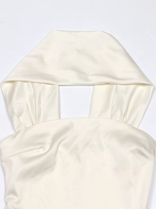 Detailed view of the elegant cream satin halter neck top with soft pleated texture