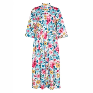 Detail of floral print maxi dress featuring stand collar and pleated waistline