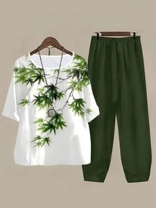 Detail of floral print top with green trousers showing fabric texture and design