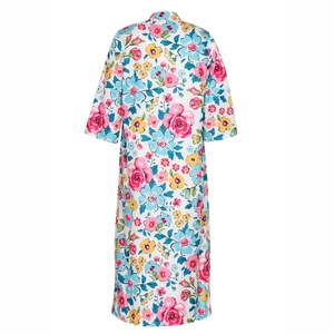 Detail view showing colorful floral pattern on a white short-sleeve summer dress back