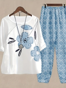 Close-up of women's floral print loungewear set with blue flower patterns and geometric pants