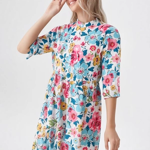 Detail view of colorful floral summer dress featuring stand collar and elastic waist