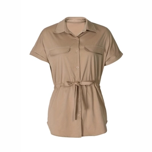 Detail view of khaki safari shirt featuring drawstring waist and chest flap pockets