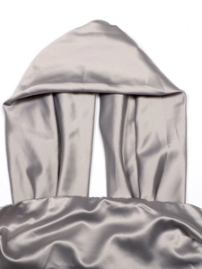 Detail of silver grey satin halter top showing silky texture and draped hood design