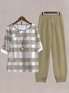 Detail of floral plaid top and khaki pants with unique petal-cut hem for women