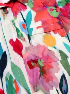 Artistic abstract floral print blouse with colorful patterns and button chest pocket