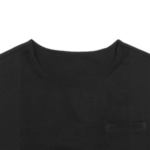 Detail shot of the crew neck stitching and functional chest pocket on black cotton tank top