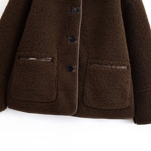 Fashionable dark brown reversible fleece jacket with stylish black buttons and side pockets