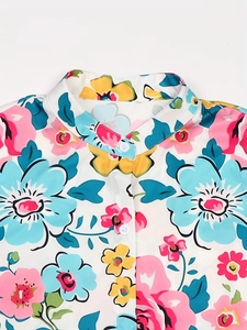 Women's summer short sleeve dress featuring colorful floral prints and buttoned neckline